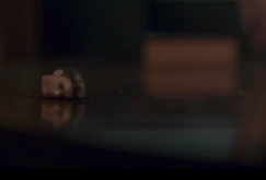 David doll with head rolling on table