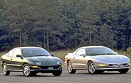 Two 1996 Pontiac Sunfire SE coupes together