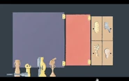 Rightmost shelf consisting trophies for a peanut, bird, plant and lightbulb