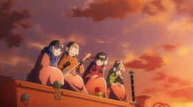 The girls sing atop a snowcat