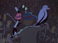 Oblina telling a crow to get off of the scarecrow.