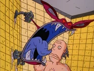 Ickis unknowingly frightens a man in the shower.