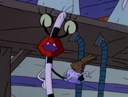 Oblina holding the chocolate bunny, the cause of Ickis's sleepscaring.