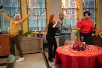 Barbara, Melissa and Mr. Johnson dancing to Christmas songs, with Jacob joining in.