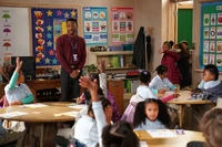 Janine's students wander off to Gregory's class.