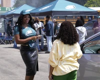 Ava tells Janine that she is using her usual parking spot to raise money for the school.