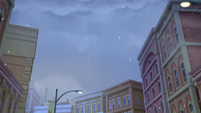 218 - Snow falling over town