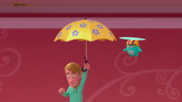 123a - Man floats down on umbrella