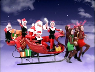 Santa Claus, his elves, and his reindeer