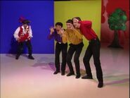 Captain Feathersword sneaking up to The Wiggles to give them a tickle