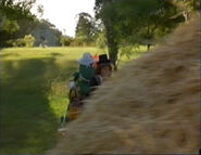 Dorothy and Wally crashing into a haystack.