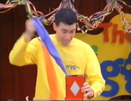 Greg holding a blue hankie