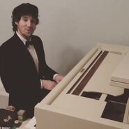 Lachy singing "When I Hear the Music of the Orchestra" while playing the piano