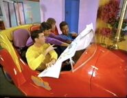The Wiggles looking at a map