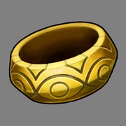 A picture of Apollo Justice's bracelet, which is a shiny gold and carved with various engravings.