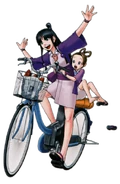 Maya Riding A Bike With Pearl