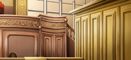 The defense's bench as seen in Ace Attorney Investigations 2: Prosecutor's Gambit (facing the witness stand)