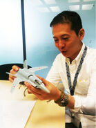 Mr. Kono inspecting a Scale model of the ASF-X Shinden II.