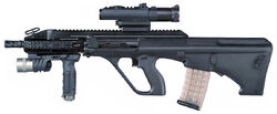 An AUG A3 fitted with a Leupold CQB/T Optic and M900 flashlight