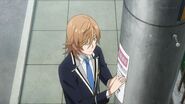 Mitsuki putting up a poster