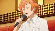 Hinata singing with a microphone while waiting