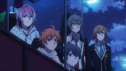 Saku, Sosuke, Uta, Hinata, and Mitsuki hiding behind a food stand