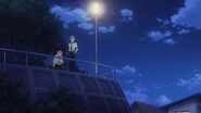 Sosuke and Uta watching from above the railing
