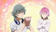 Uta showing Sosuke the tablet with delight
