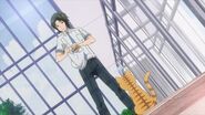 Rei picking up the cat can