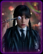 Wednesday holding an eyeball with forceps