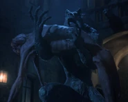 Francoise's corpse hanging in the statue's arms