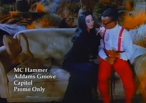  and MC Hammer, seated on Mona's tombstone