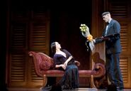 Lurch delivering flowers to Morticia - The Addams Family: A New Musical