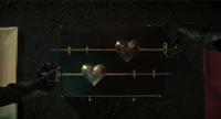 Two fencer swords going through hearts from the Wednesday series