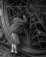 Emma Myers looking through her dorm window