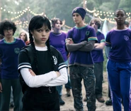 Eugene, Wednesday, Ajax, Bianca, and other Nevermore Students standing