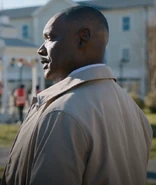 The Mayor walking to greet Nevermore's student while talking to the sheriff