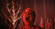 Larissa screaming as the fake blood rains at the Rave'N.