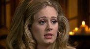 Adele being interviewed by Anderson Cooper.