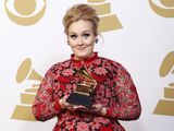 Adele-poses-with-her-grammy-award-for-best-pop-solo-performance-for-her-song-set-fire-to-the-rain-live-backstage-at-the-55th-annual-grammy-awards-in-los-angeles-california-february-