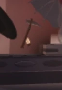 ScytheGrapplingHookDisplay.jpeg (7 KB) The Halloween Wooden Scythe Grappling Hook on display in the Halloween Shop.