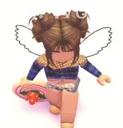 A player holding the Strawberry Cake Roll Flying Disc.