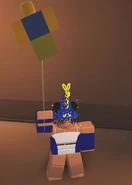 A player holding the Noob Balloon.