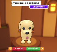 The Yarn Ball Earrings on a Dog.