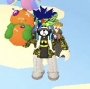 A player holding a Halloween Orange Pumpkin Voodoo Doll.