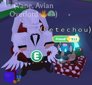 A player and their Pet sitting on the Santa Throne.