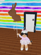 A player holding the Chocolate Bunny Balloon.