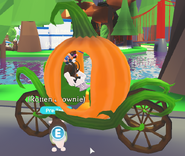 A player riding the Pumpkin Carriage