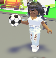A player holding the soccer Ball Throw Toy