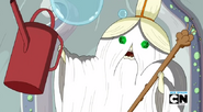 S5 e26 Grand Master Wizard holding up watering can